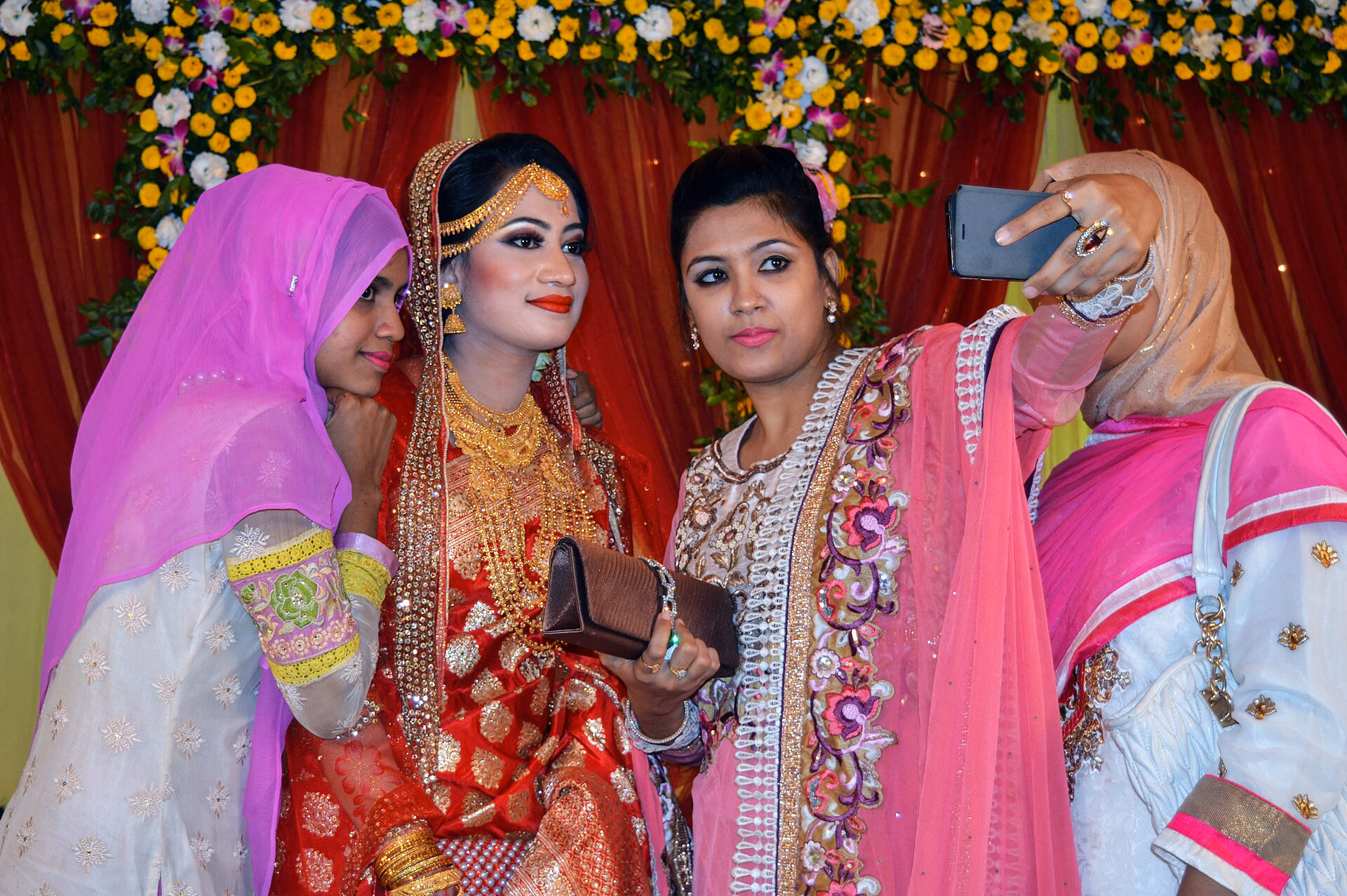 Women taking a selfie at a wedding celebration