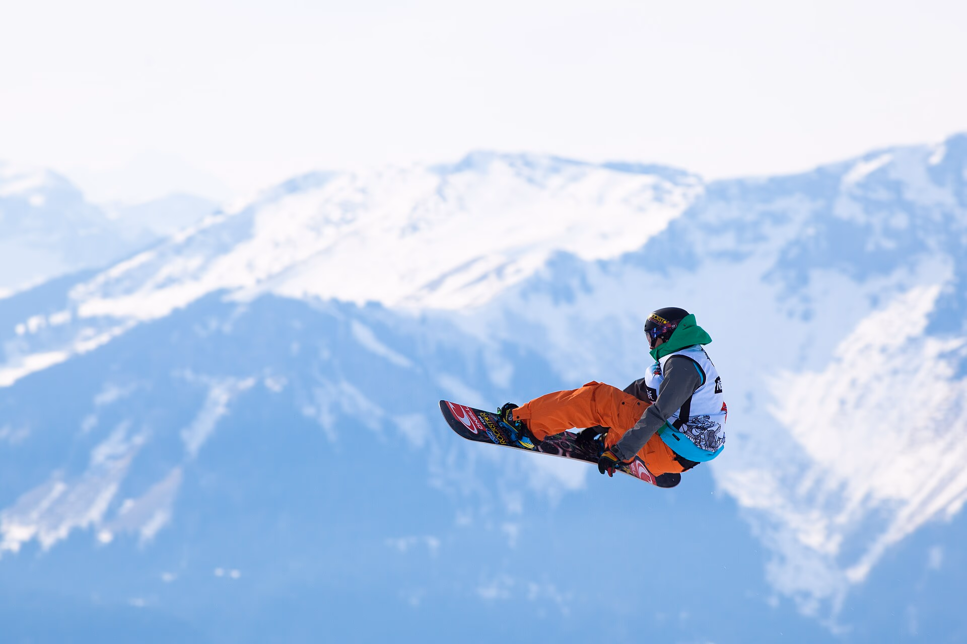 A snowboarder mid-manoeuvre