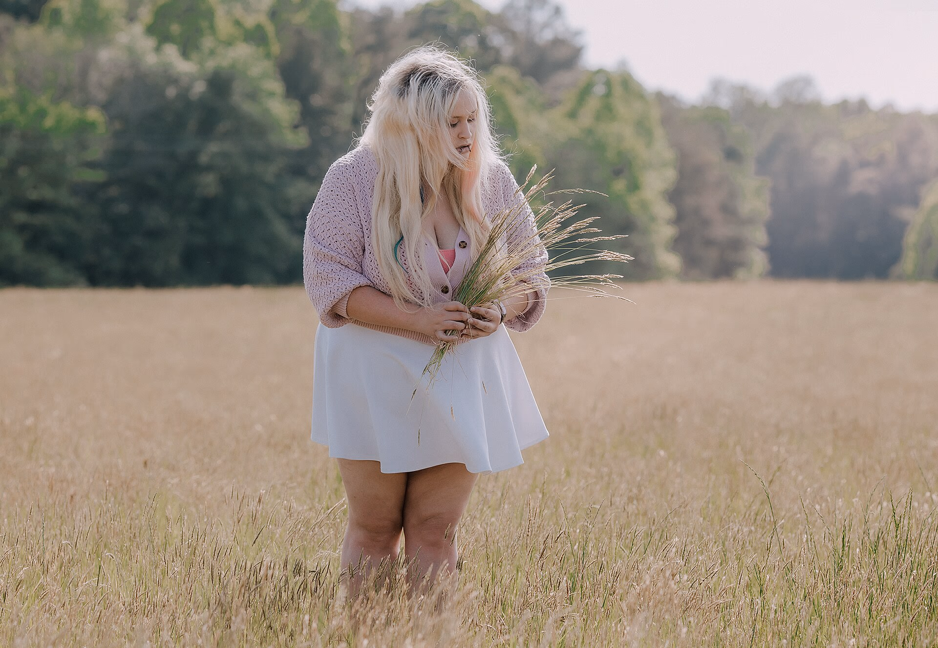 A plus-size model portrait in natural light