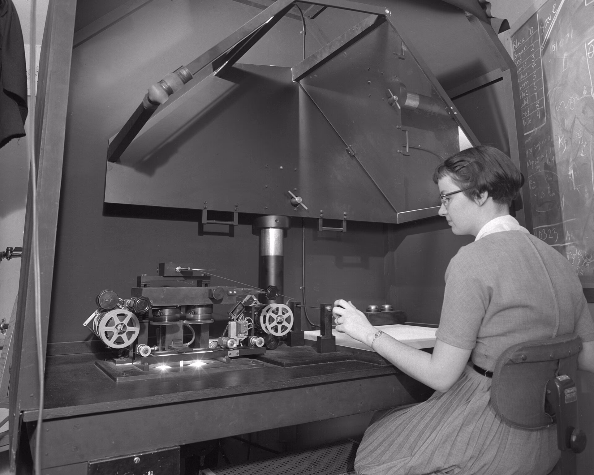 Operator loading a 35mm film scanner
